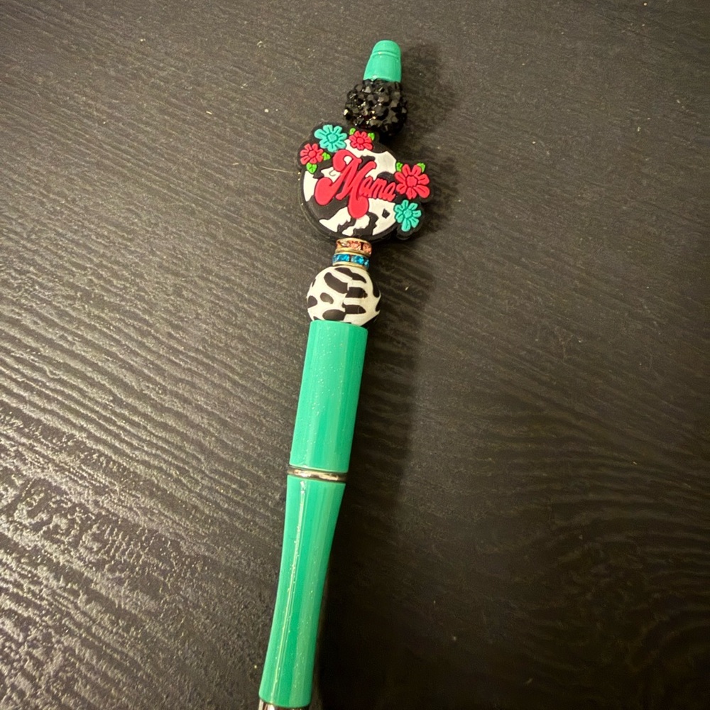 Green and Black Decorative Pen